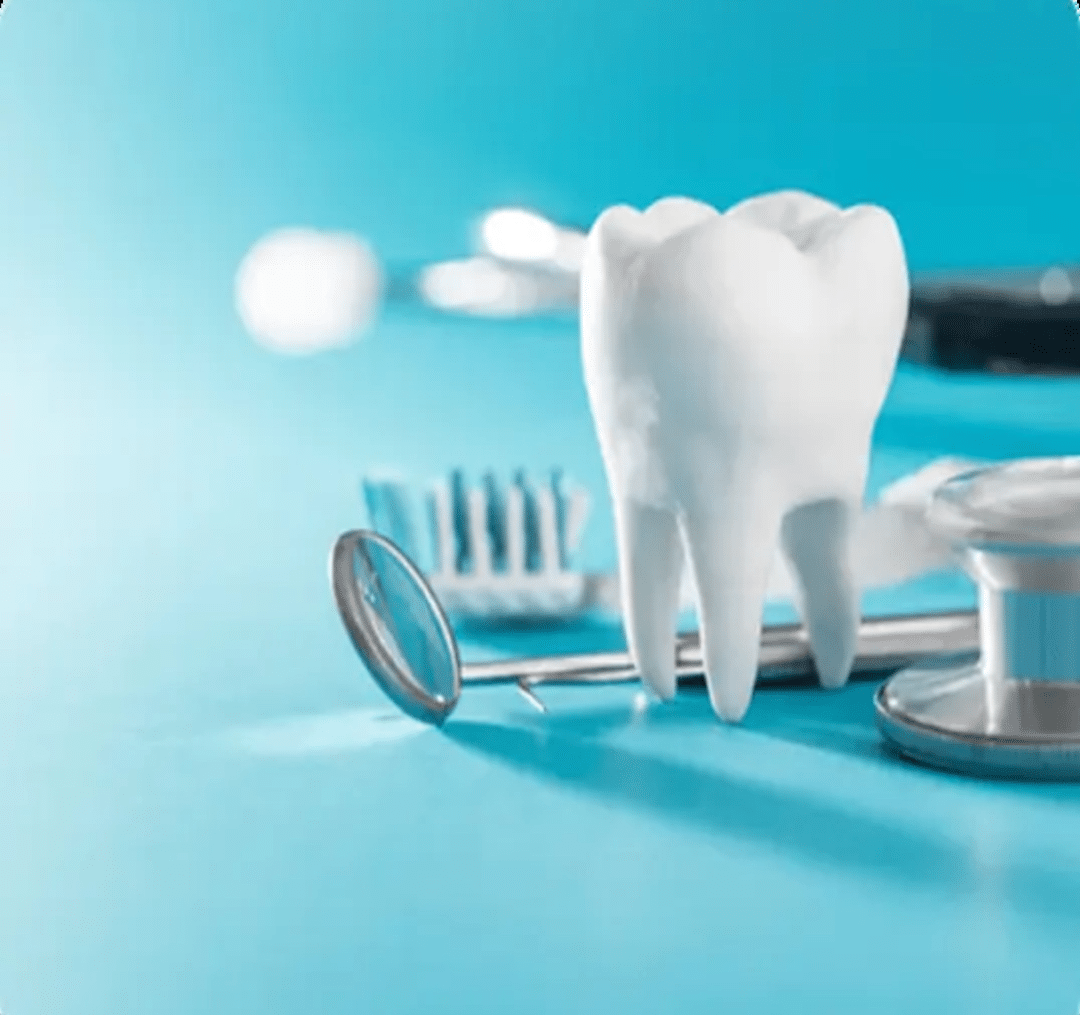 A large white molar model placed next to professional dental diagnostic tools, a stethoscope, and a dental mirror on a blue background.